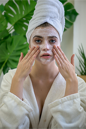 Woman wearing a face mask for self care